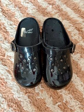 Dansko Black Patent Studded Clogs with Adjustable Strap